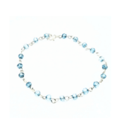 Delicate bracelet featuring 4 mm blue topaz gemstones, each individually wire-wrapped in sterling silver and linked together with a sterling silver clasp.