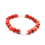 Vibrant stretch bracelet featuring 8 mm carnelian beads with rose quartz accents