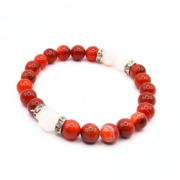 Vibrant stretch bracelet featuring 8 mm carnelian beads with rose quartz accents