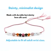 A nurturing fertility bracelet with moonstone, aquamarine, rhodonite, rose quartz, and unakite, accented with sterling silver on an adjustable pink silk cord. Designed to support fertility and emotional well-being.