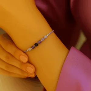 Adjustable silk cord bracelet of a models wrist