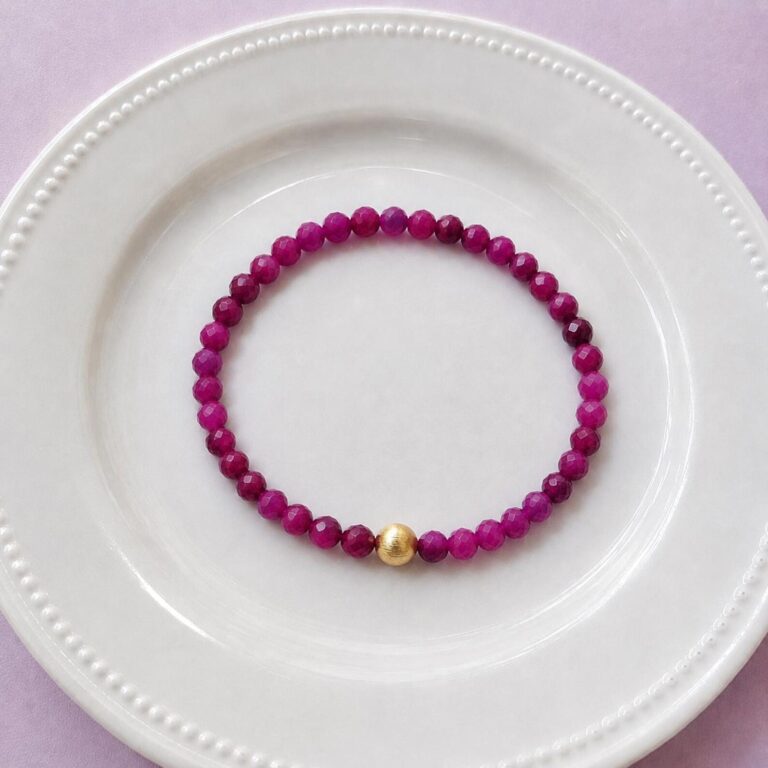 Red ruby bracelet with 18k gold filled accent bead, elastic construction